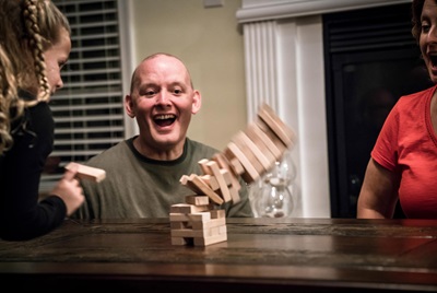 Dan Bonner, liver transplant recipient, playing Jenga with family